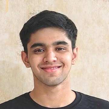 Portrait of Aarit Hooda, founder of JEE AI Mentor, smiling, in a dark t-shirt